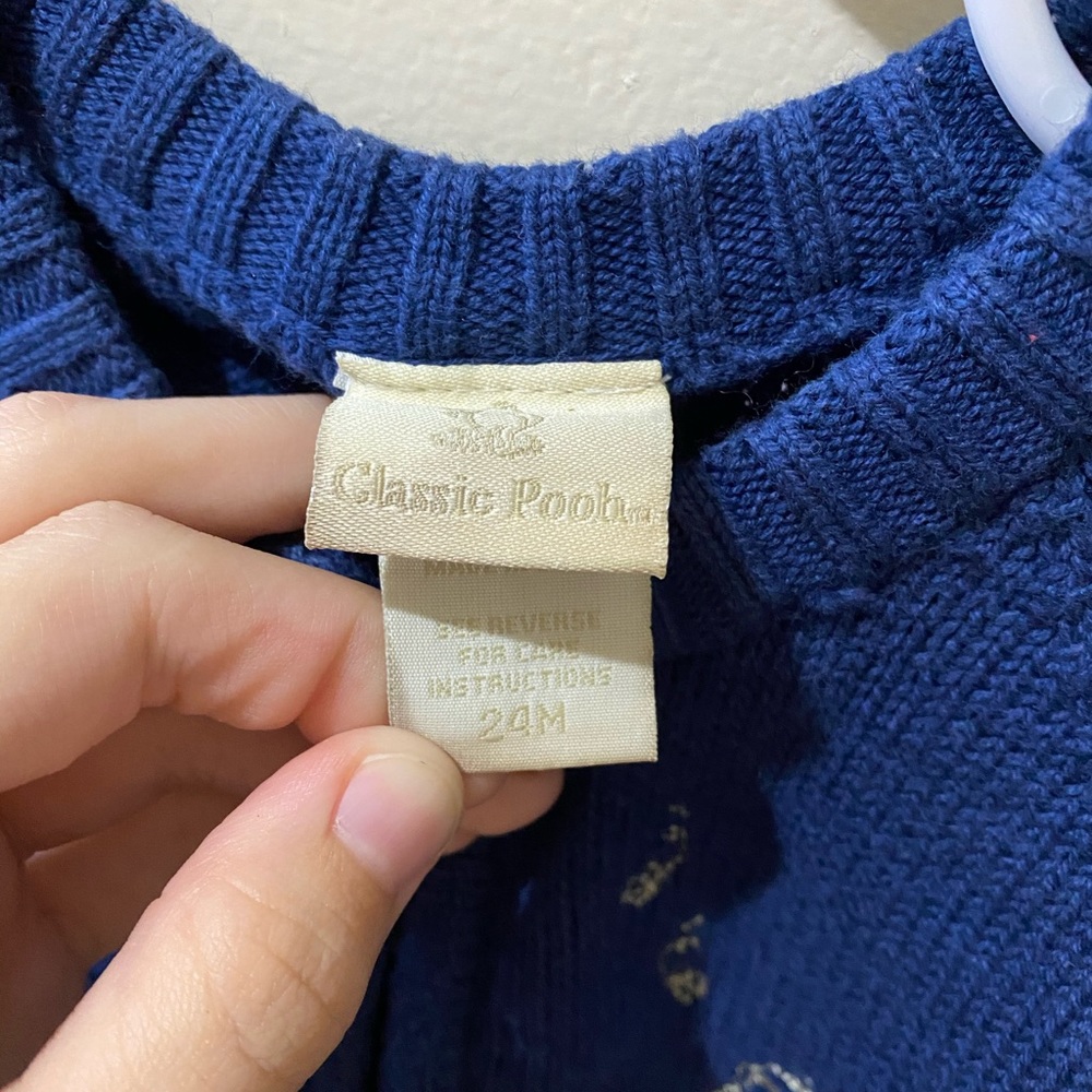 blue and tan "classic pooh" zip up sweater.